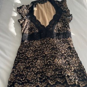 Black and gold lace low neck top with black lace band really cute on one size
